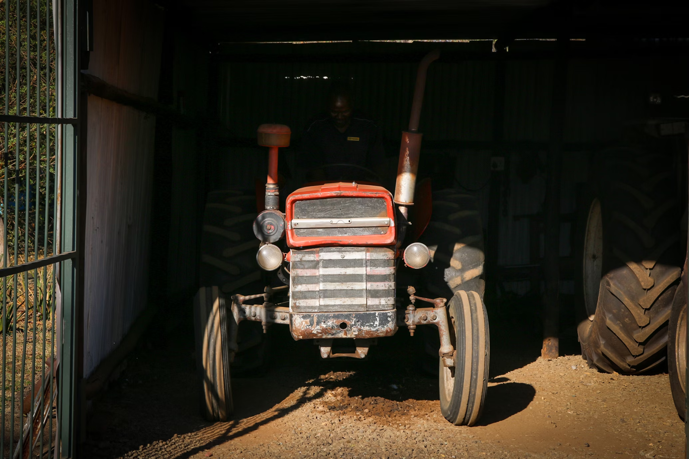 Well-maintained farm equipment stored in barn